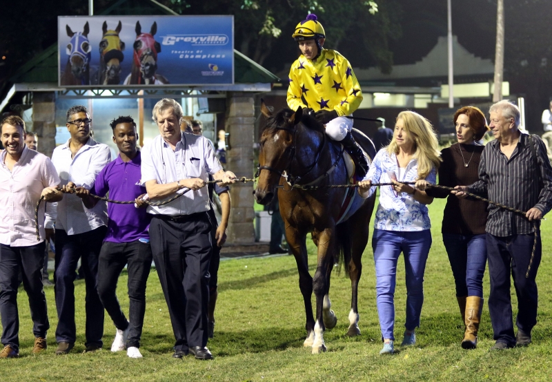 Sunny Bill Du-Toy being led in by the Hollywood Syndicate after his second victory at Greyville - Horse Racing