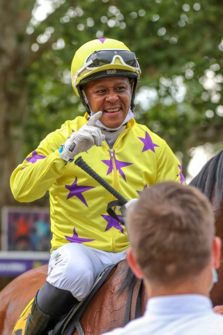 Muzi Yeni saluting on Time To Roll after winning at Hollywoodbets Scottsville - Lead-in - 20220213 -